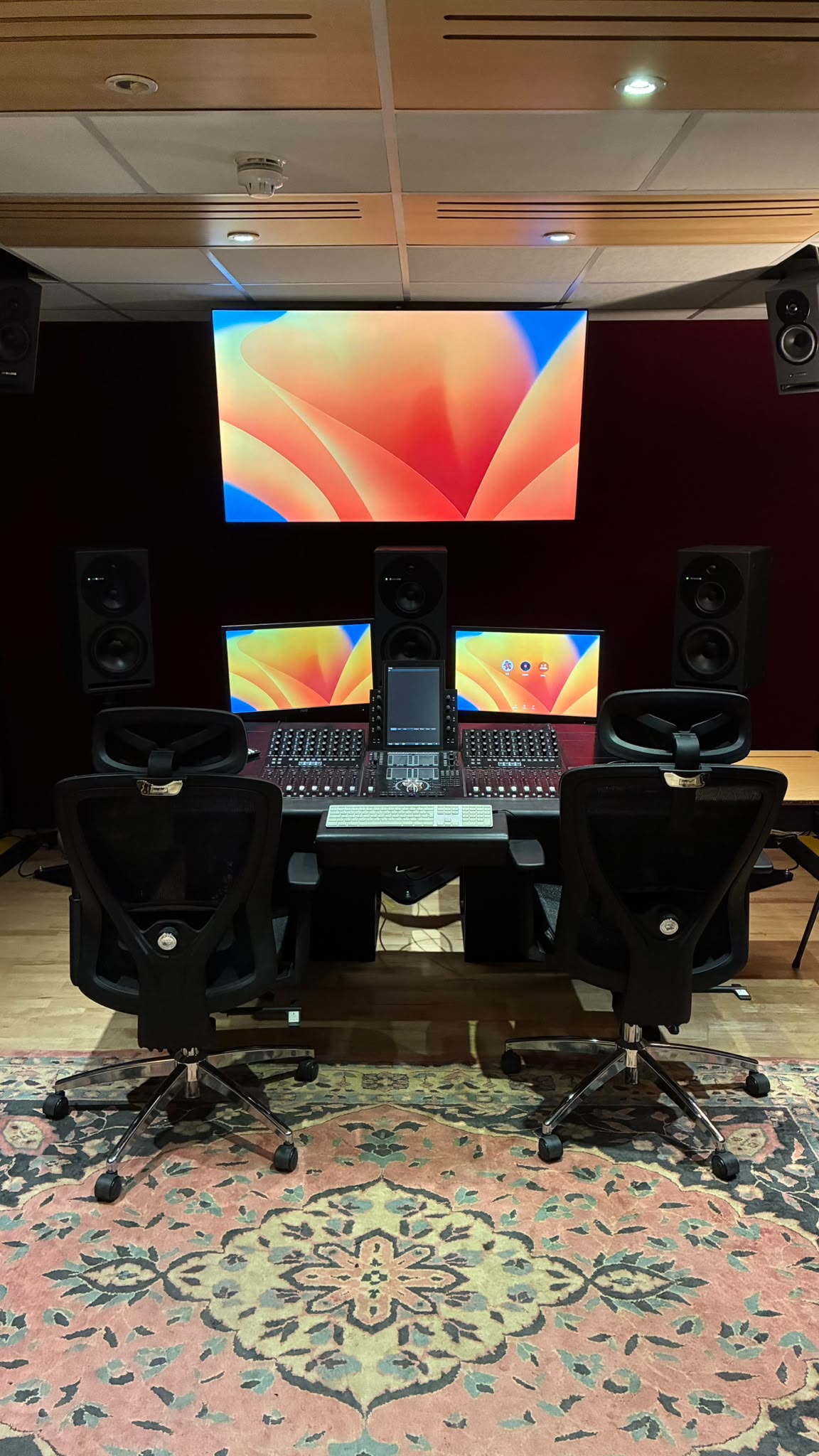 Front view of the Avid S4 and projection screen in the Dolby Atmos room.