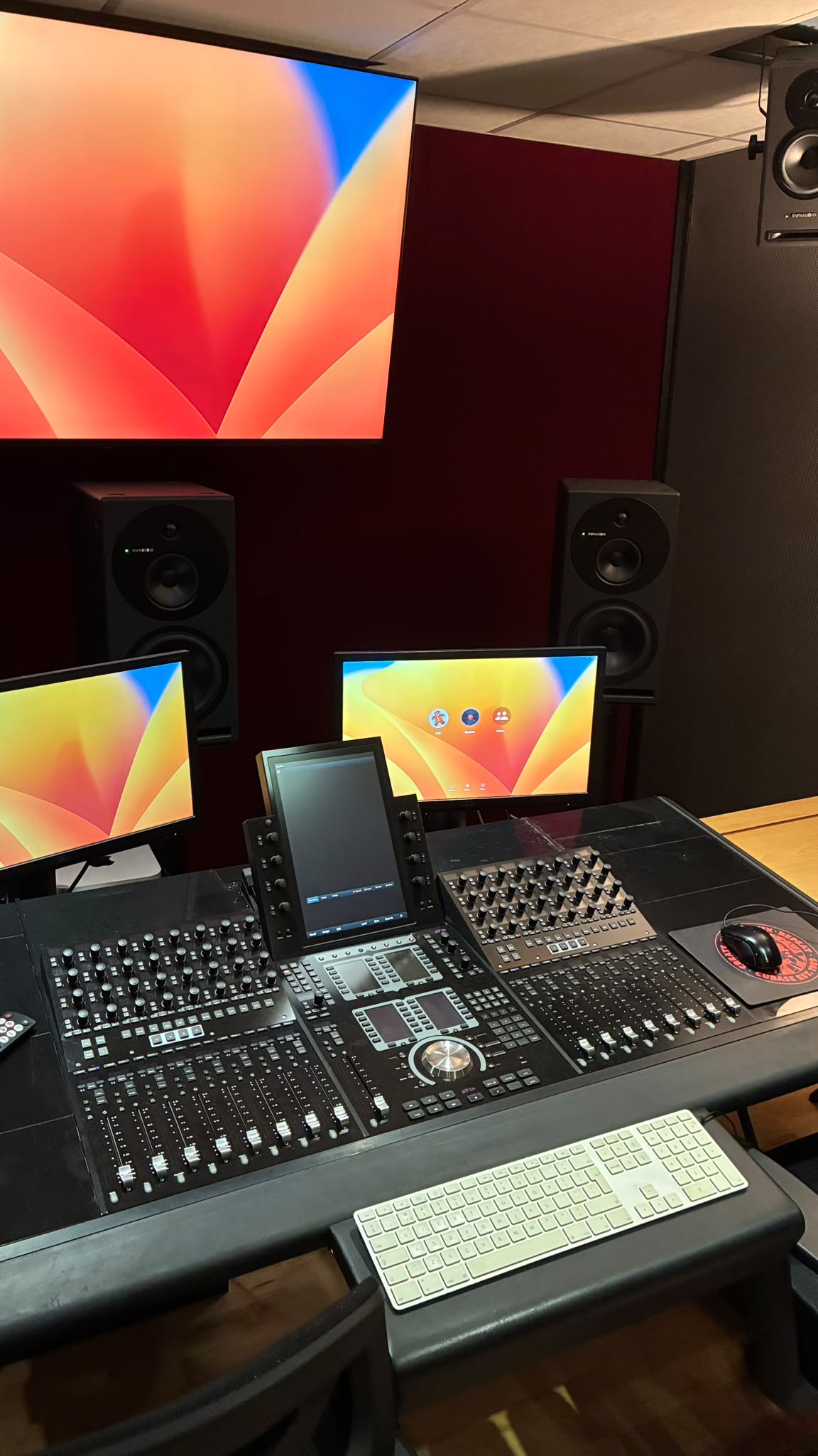 Closer view of the Dolby Atmos mix setup and monitors.